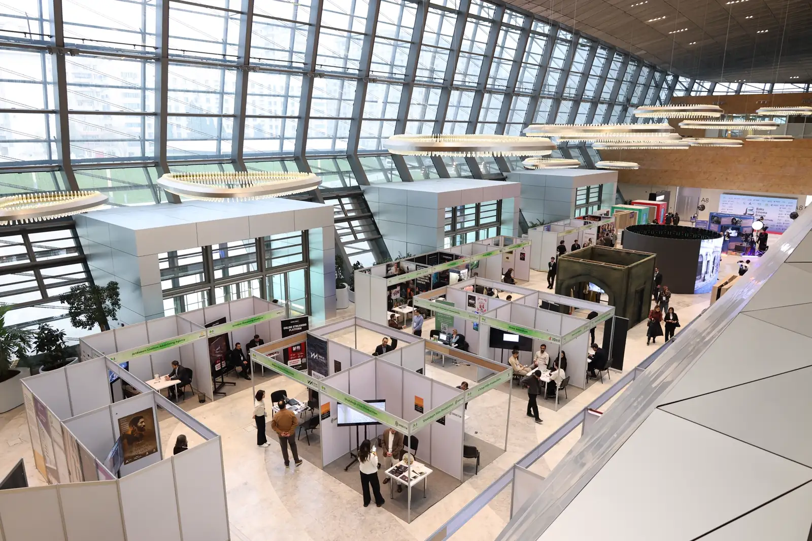 Trade show exhibition booths inside a modern convention hall